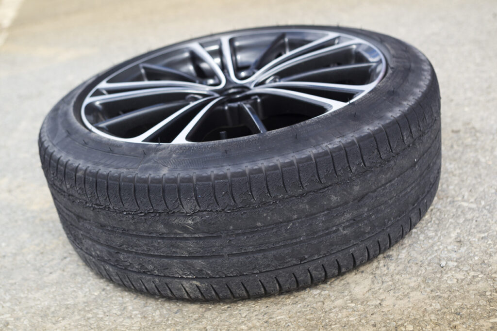 Damaged rubber tire on a rim