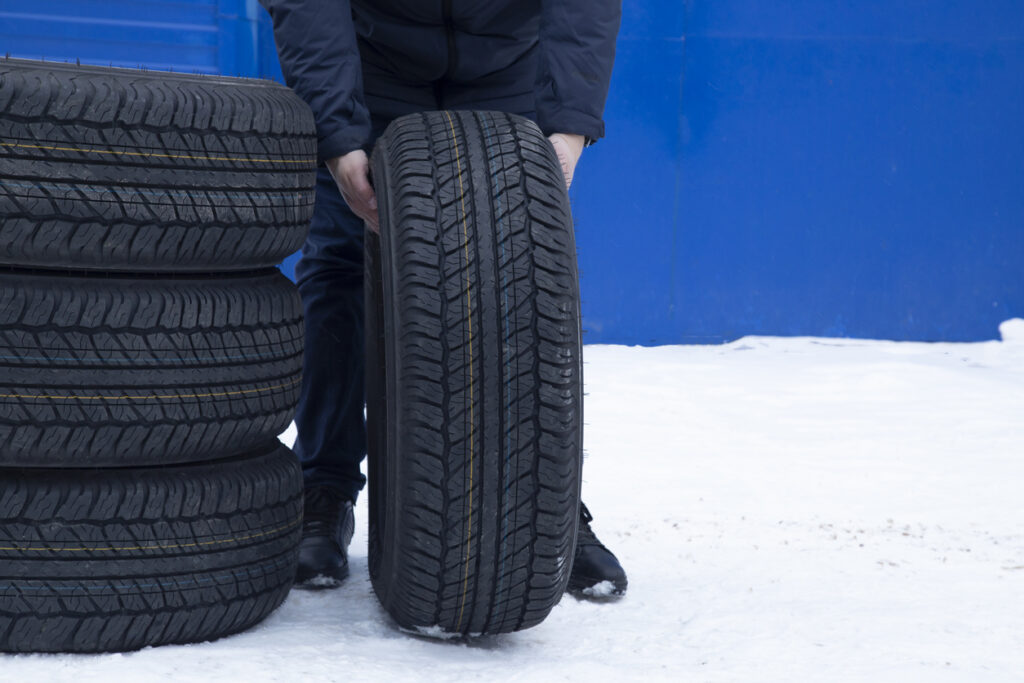 A set of summer tires for a car on the street.Replacement of car tires.