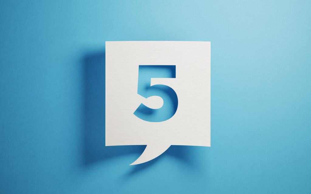 White chat bubble on blue background. Number five writes on chat bubble. Horizontal composition with copy space.