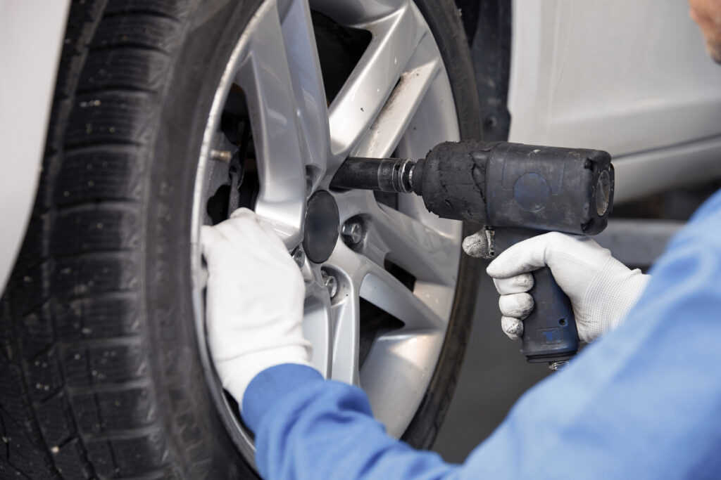 Tire repairer changing the car tire