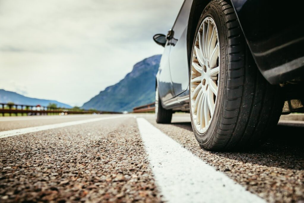 Close up of a car standing on a breakdown lane, summer vacation