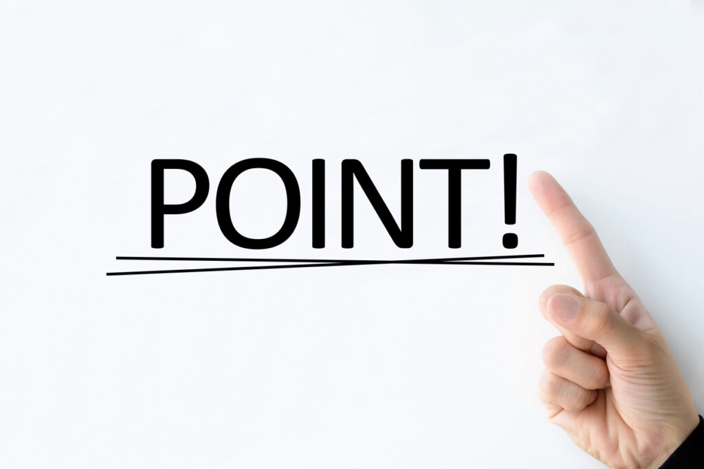 Business man's hand pointing at POINT" word on white board