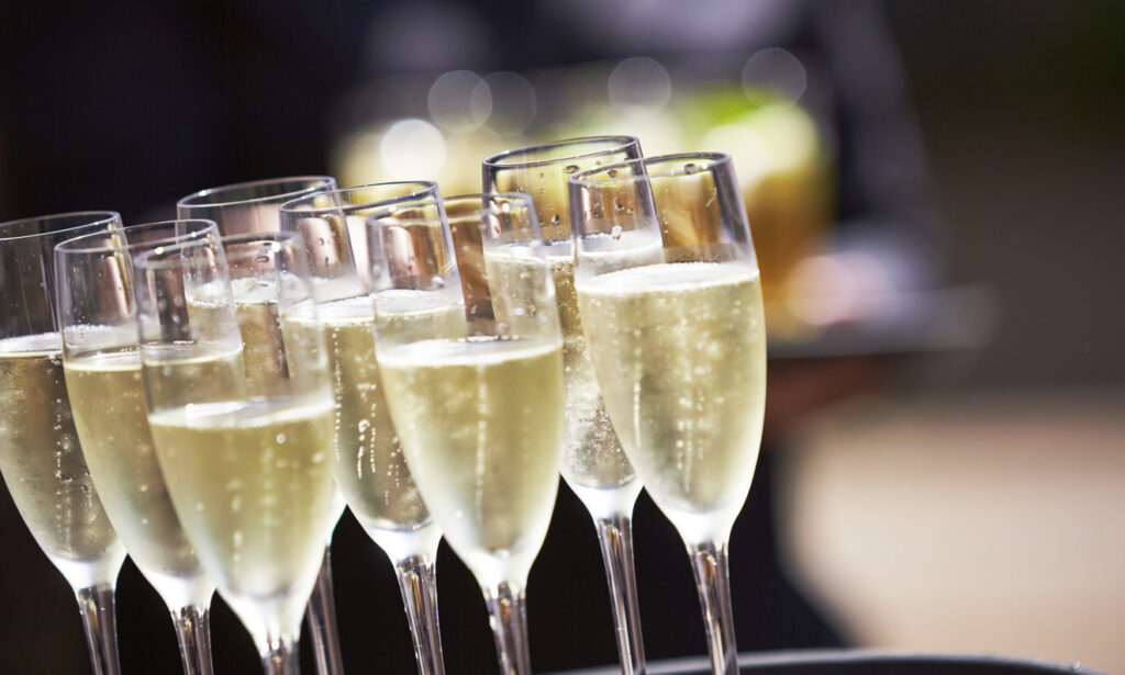 Champagne drinks being served on a tray